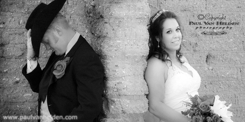 Austin and Valerie take part in a few wedding photos by the adobe brick at Corona Ranch.