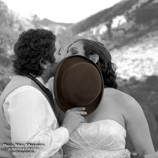 Robert and Rachel enjoy a private kiss at the Sunglow Ranch in Pearce, Arizona.